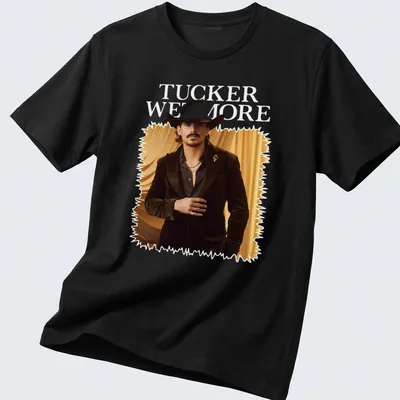 Fashion portrait T-shirt featuring a man in a cowboy hat and the name Tucker Wetmore — printed on a unisex t-shirt