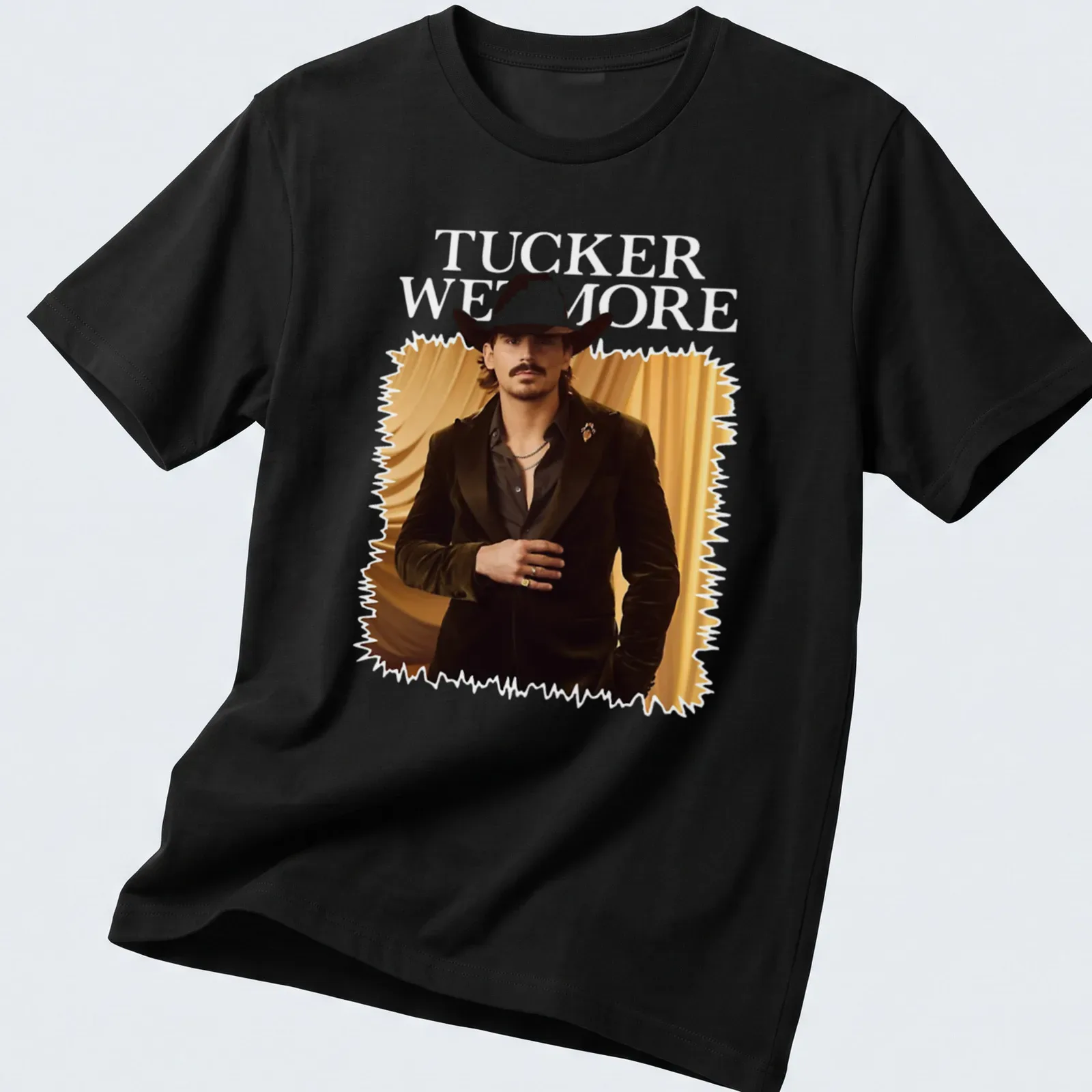 Fashion portrait T-shirt featuring a man in a cowboy hat and the name Tucker Wetmore — printed on a unisex t-shirt