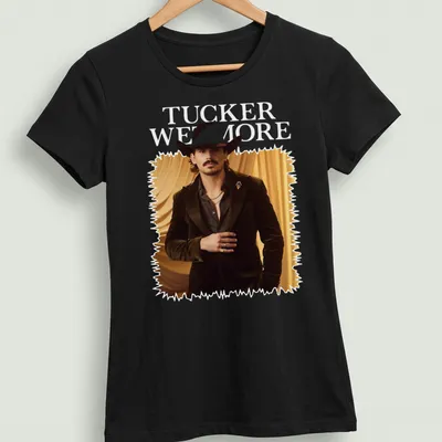 Fashion portrait T-shirt featuring a man in a cowboy hat and the name Tucker Wetmore — printed on a women's shirt
