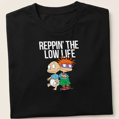 Cartoon T-shirt featuring two playful babies with joyful expressions