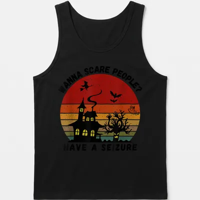 Vintage witch and haunted house graphic with bold printed text in Halloween colors — printed on a tank top