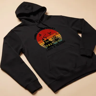 Vintage witch and haunted house graphic with bold printed text in Halloween colors — printed on a unisex hoodie