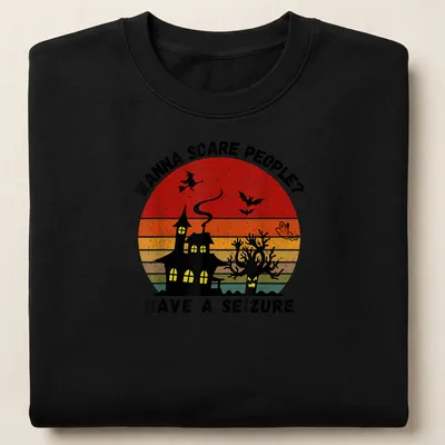 Vintage witch and haunted house graphic with bold printed text in Halloween colors — printed on a unisex sweatshirt