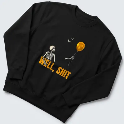 Cartoon skeleton holding a balloon with the text WELL, SHIT in orange and black — printed on a unisex sweatshirt