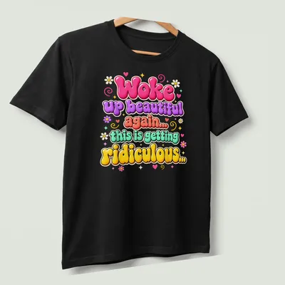 Retro bubble style shirt with colorful humorous text about beauty — printed on a unisex t-shirt (angled view)