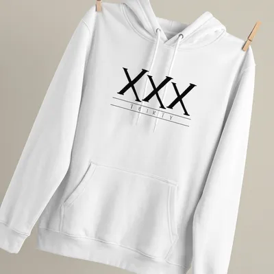 Black t-shirt featuring bold printed text of the Roman numerals XXX THIRTY — printed on a unisex hoodie