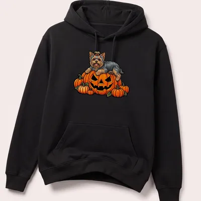 Cartoon Yorkshire Terrier on a pumpkin for Halloween with vibrant colors — printed on a unisex hoodie