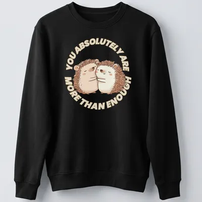 Cute hedgehogs with the text You Absolutely Are More Than Enough in a whimsical illustration. — printed on a unisex sweatshirt