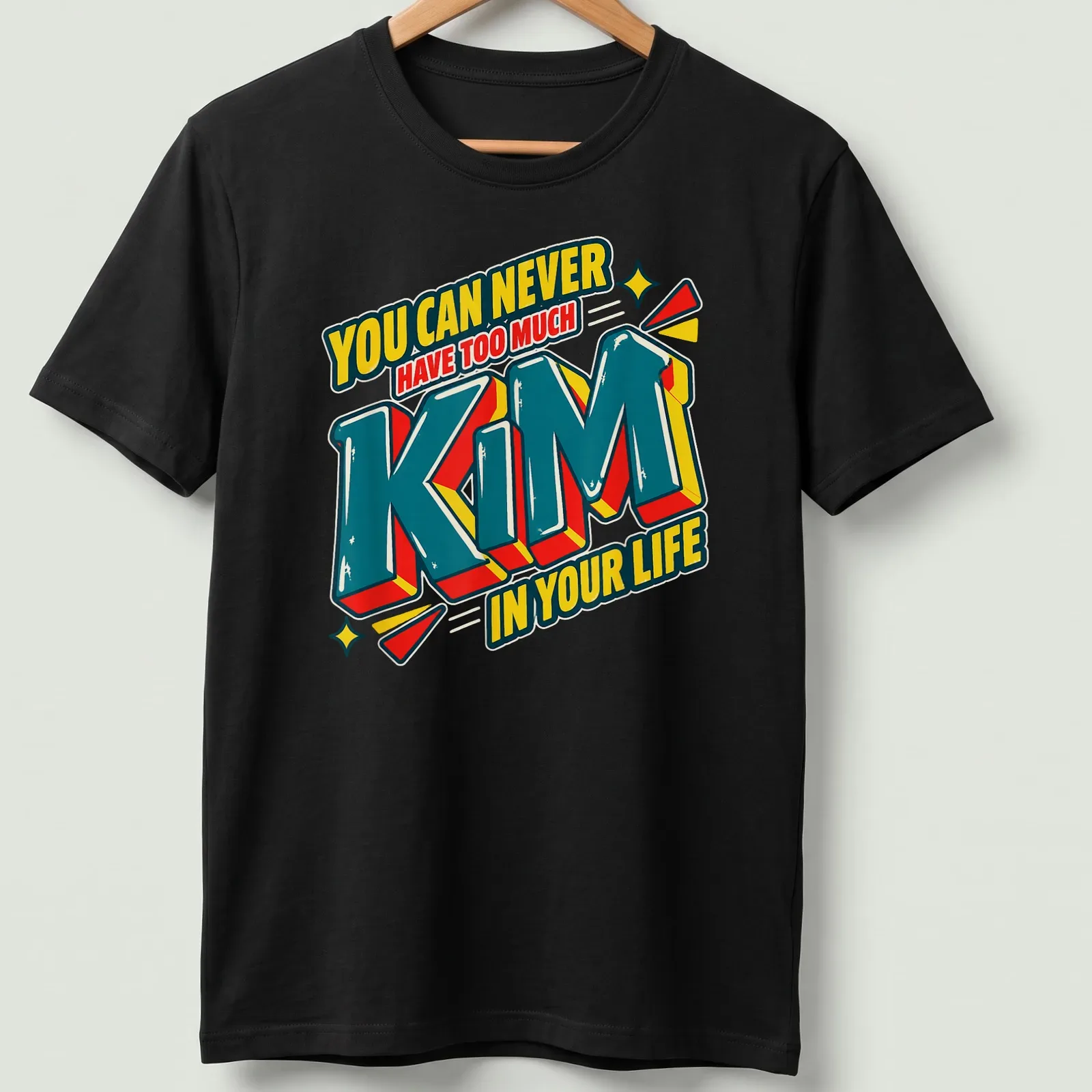 Bold 3D printed text reading 'You Can Never Have Too Much Kim In Your Life' in vibrant colors. — printed on a unisex t-shirt