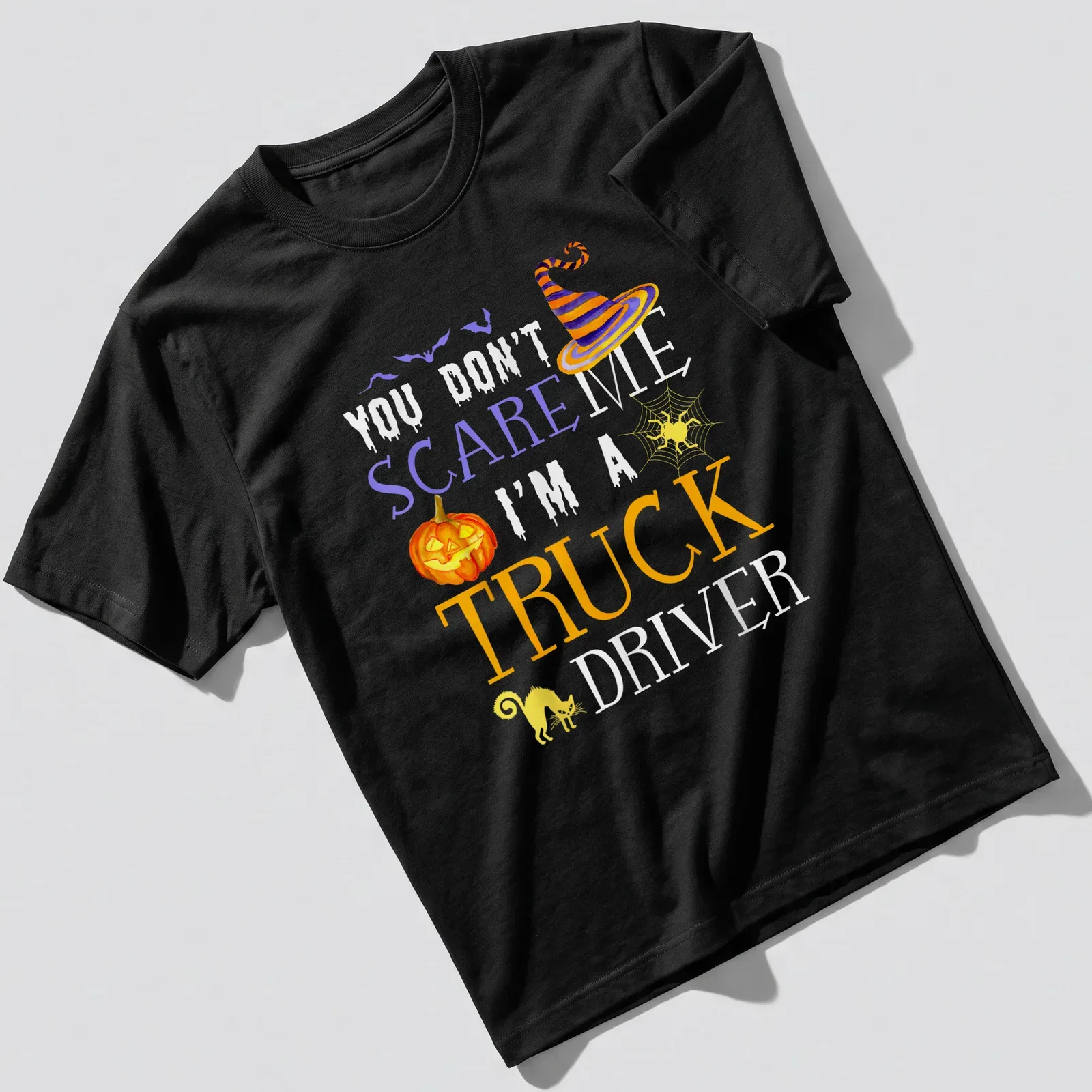 Whimsical Halloween truck driver t-shirt with pumpkin, witch hat, and black cat — printed on a unisex t-shirt