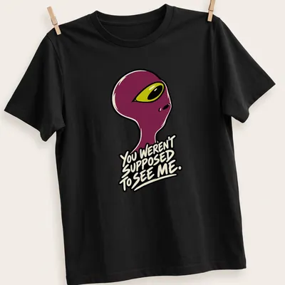 Cartoonish alien graphic with humorous text about being seen.